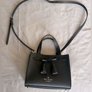 Gently used Kate Spade small purse. Removable strap. No dust bag.